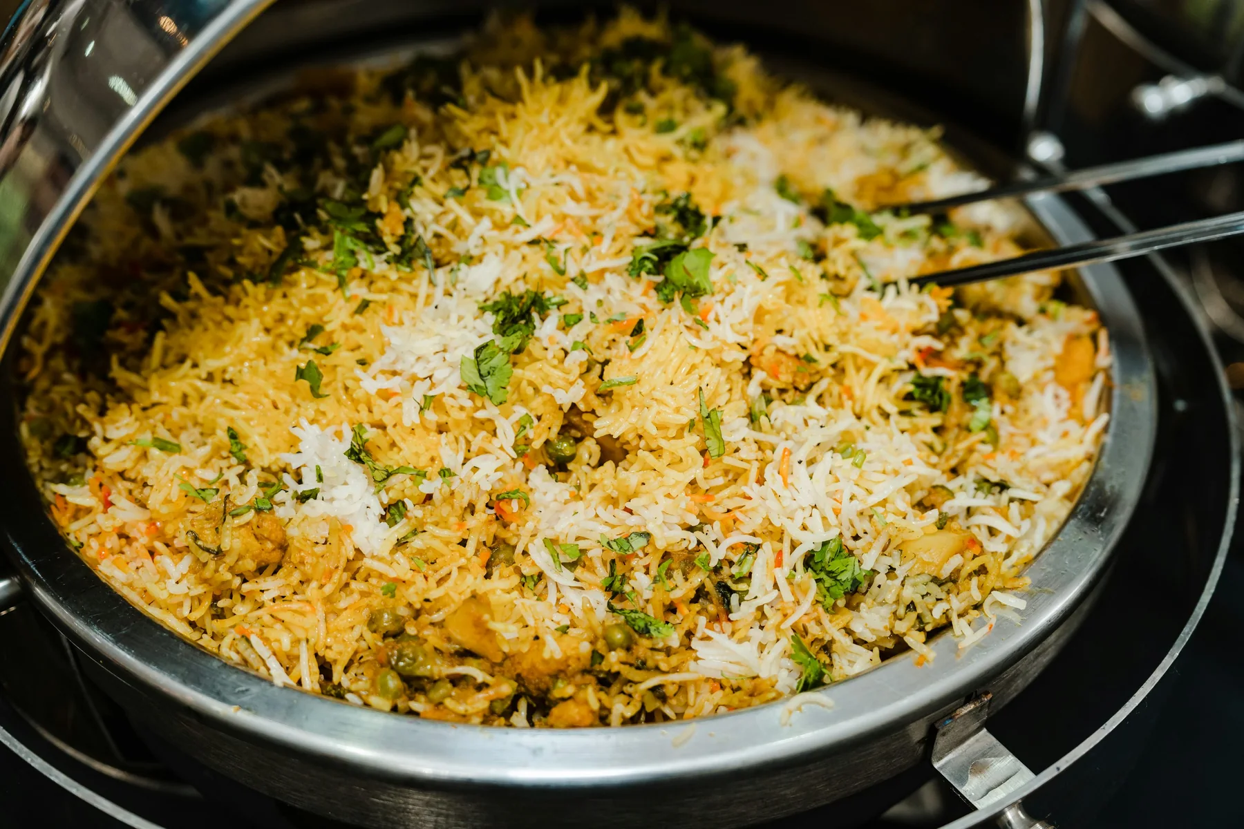 Fragrant basmati rice layered with saffron, spices, and fresh herbs