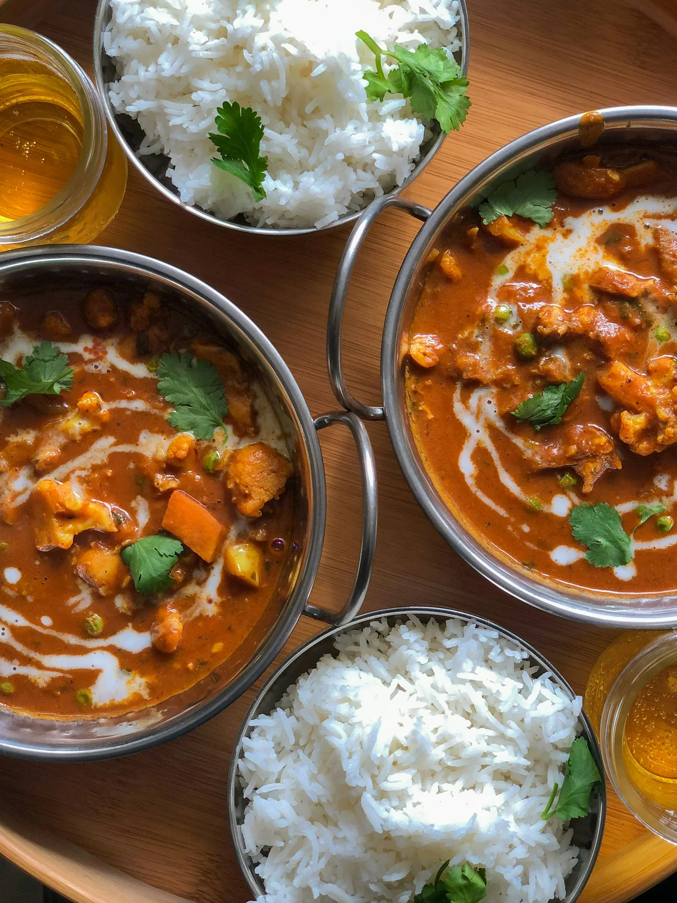 Freshly prepared Indian ingredients and a colorful family-style meal